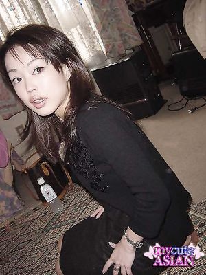 Cute Asian chick flashing her lovely breasts