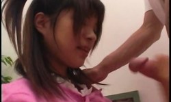 Young Japanese nurse Mana Lizuka gives her patient a good head