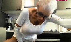 Short haired mature woman fucks her dildo