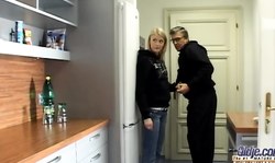 Old man seduces a slender young blonde in the kitchen