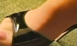 Cute Nylon Fetish chick on glossy high heels undresses in the bed