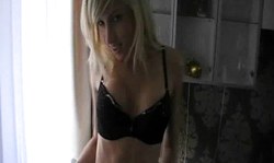 Beautiful small-tit blonde in stockings undresses like a stripper