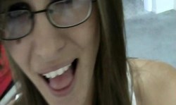Nerdy babe in glasses sucks a juicy fat boner with pleasure