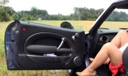 Big-boobed blonde in red miniskirt flashes her cleavage