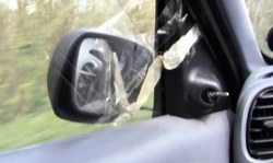 Good pigtailed MILF in stockings drives a car and flashes her panties