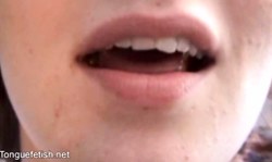 Sensual girl with pierced tongue gives a deep blowjob on the bed