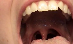 Good-looking amateur brunette reveals her giant tongue