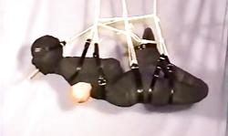 Roped babe is standing still while getting some humiliations