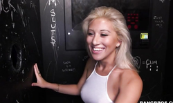 Oral sex through the hole in the gloryhole with blonde