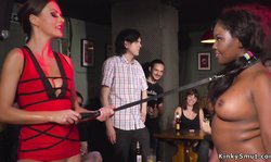 Ebony slave gets lezdom in public