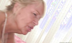 Slutty granny Regi is getting penetrated in the cowgirl pose