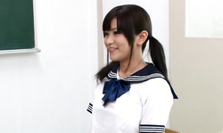 Smiling Japanese beauty posing in front horny students