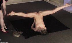 Redhead Domina Wasteland sticks a big dildo in a tight ass of a brunette