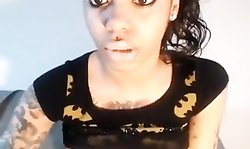 tattooed ebony showing off her titties