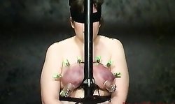 Slutty blindfolded babe feels real pressure in her huge tits