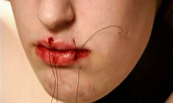 The insane BDSM doctor is trying to make her mouth even smaller