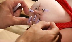 Master carefully shoves nails in her cute and hard nipples