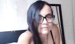 hot babe with glasses enjoys fingering her wet pussy