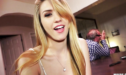 Playful long-haired blonde makes blowjob in public place