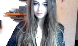 Truly young and innocent chick is poking her ass with a dildo