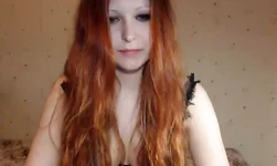 Impressive redhead beauty is enjoying her black lingerie