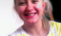 Smiling blonde is talking dirty on the camera on Russian