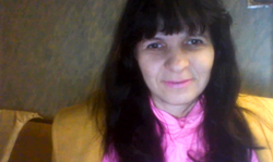 Sexy playful mature is talking dirty and smiling in cam