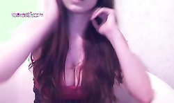 Lovely Russian doll with massive tits poses in a hot way