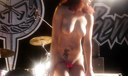 Cute amateur is slowly undressing and showing off her boobies