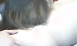 Angelic Russian brunette is lying on the bed and sucking his hard dick