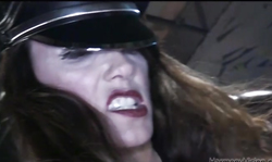 Submissive blonde is blowing a massive boner through the cage