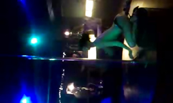 Gorgeous chick on high heels is posing on the shaft