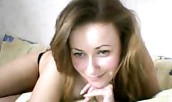 Smiling Russian cutie is really enjoying her naked body