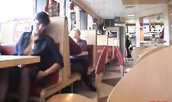 Busty babe flashing in a restaurant