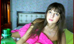 Slutty Russian is drinking alcohol right in the bedroom