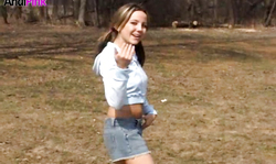 Tanned beauty Andi Pink is walking sexy in the woods in denim jeans