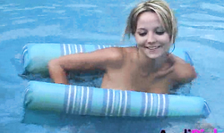 Busty naked teen Andi Pink shows herself in the pool
