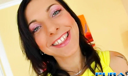 Smiling young girl enjoys masturbation in front camera