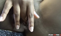 Ebony fingers her pussy after a nice striptease