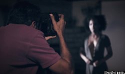 Photographer makes an ebony model squirt