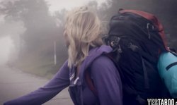 Teen hitchiking in the middle of nowhere