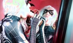 Glamorous spider-woman is sucking a big rubber dick with love