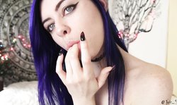 Purple-haired hottie with blue eyes sucks a good rubber toy