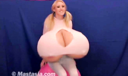 Pigtailed blonde with long legs is enjoying boob fetish