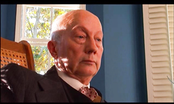 Glamour redhead in black dress Kylie Ireland is enjoying oral sex