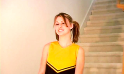 Lusty cheerleader in pantyhose takes off her outfit in a hot way