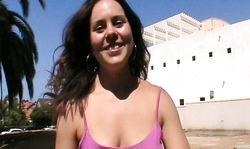 Sweet brunette with cute smile is flashing her awesome boobs