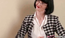 Dark-haired Aunty Kathy shows off herself in sexy lingerie