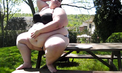 Gigantic BBW Luna is posing almost nude at the backyard