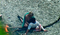 Sweet couple spotted during beach sex in the cowgirl pose